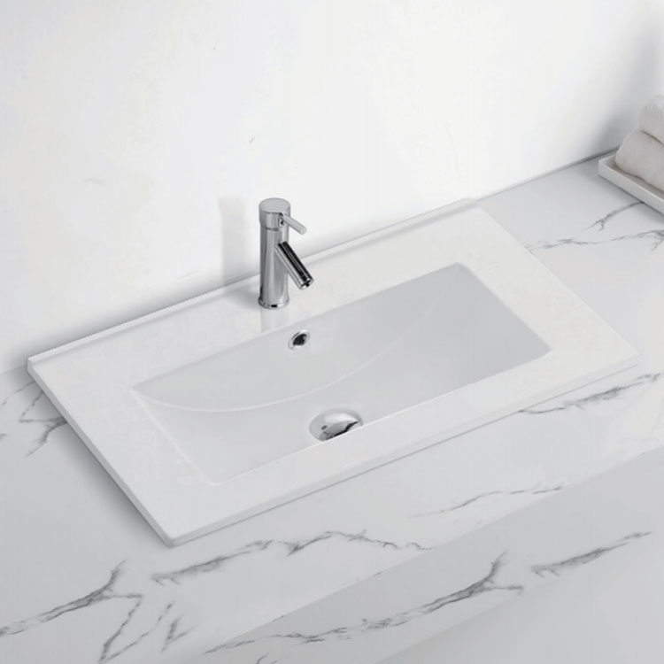 Hur kan jag reparera och underhålla repor på min keramiska handfat?